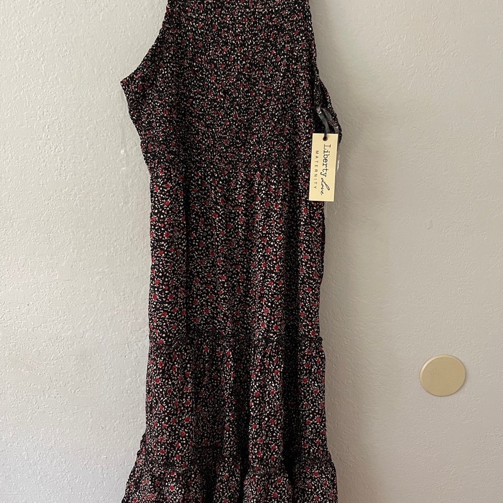Liberty Love maternity dress in medium. Black dress with small red flowers.